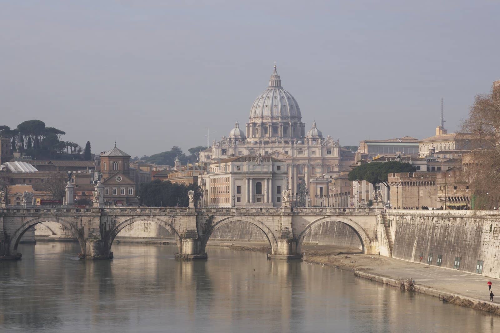 Dome of St Peters rising over the River Tiber in Rome, Italy