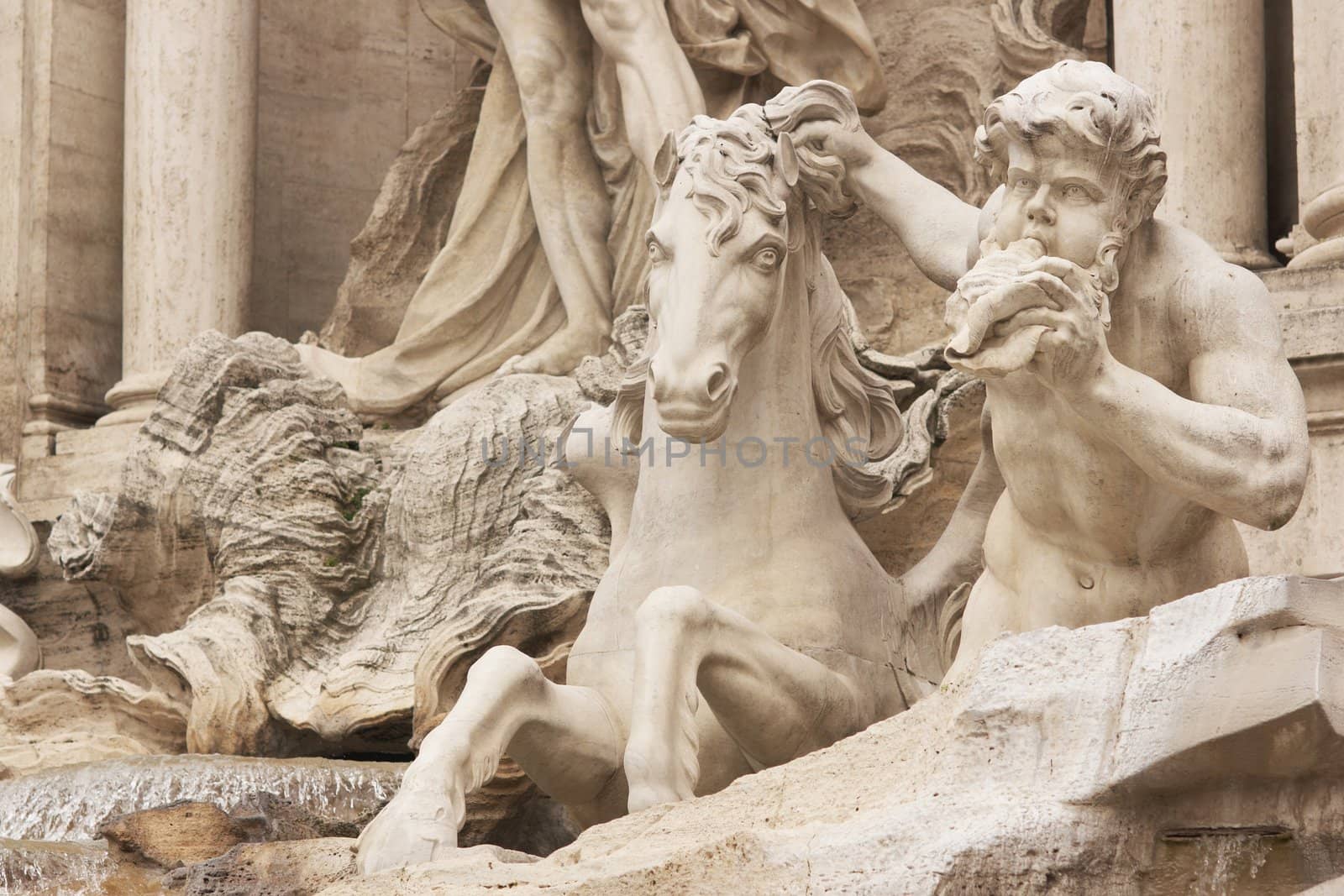 Detail of statues adorning the Trevi Fountain in Rome, Italy