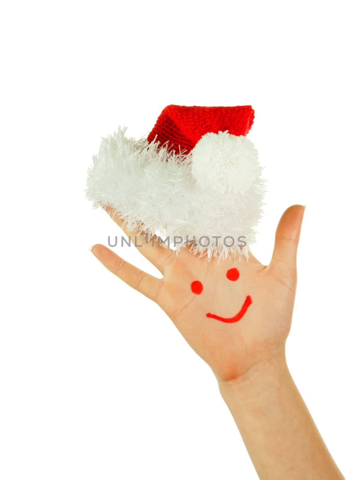 Human's palm with smile on it wearing Santa's hat