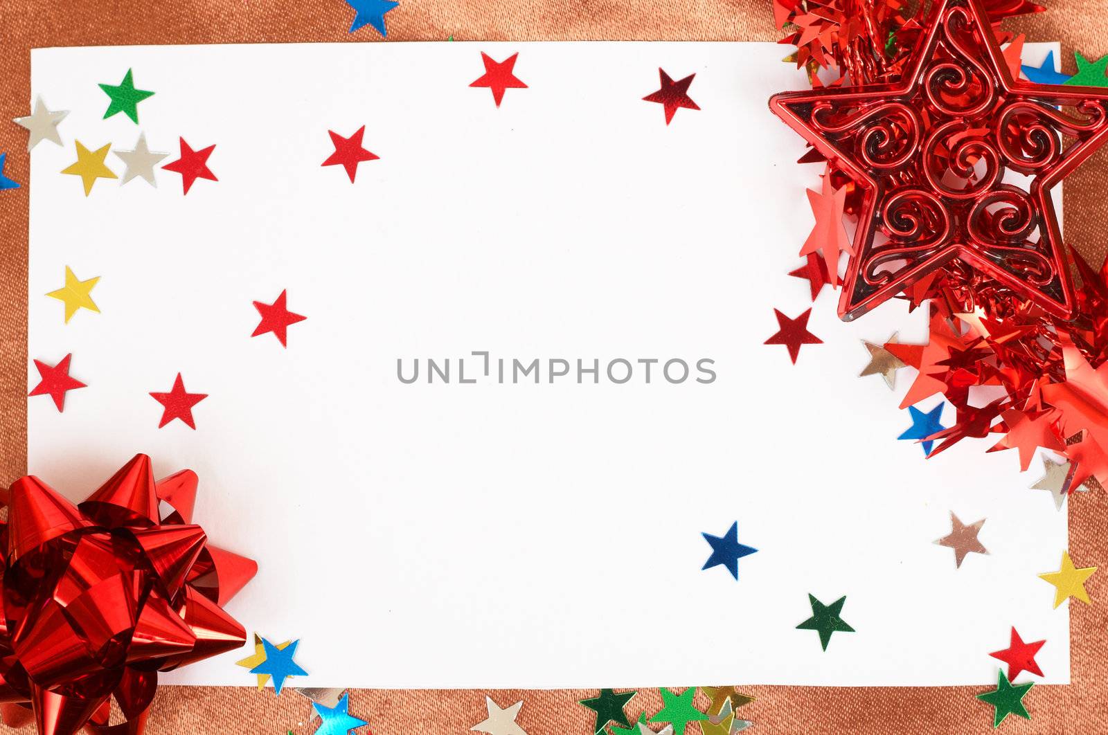 White Christmas card with stars and bowsdecorations on golden silk nackground