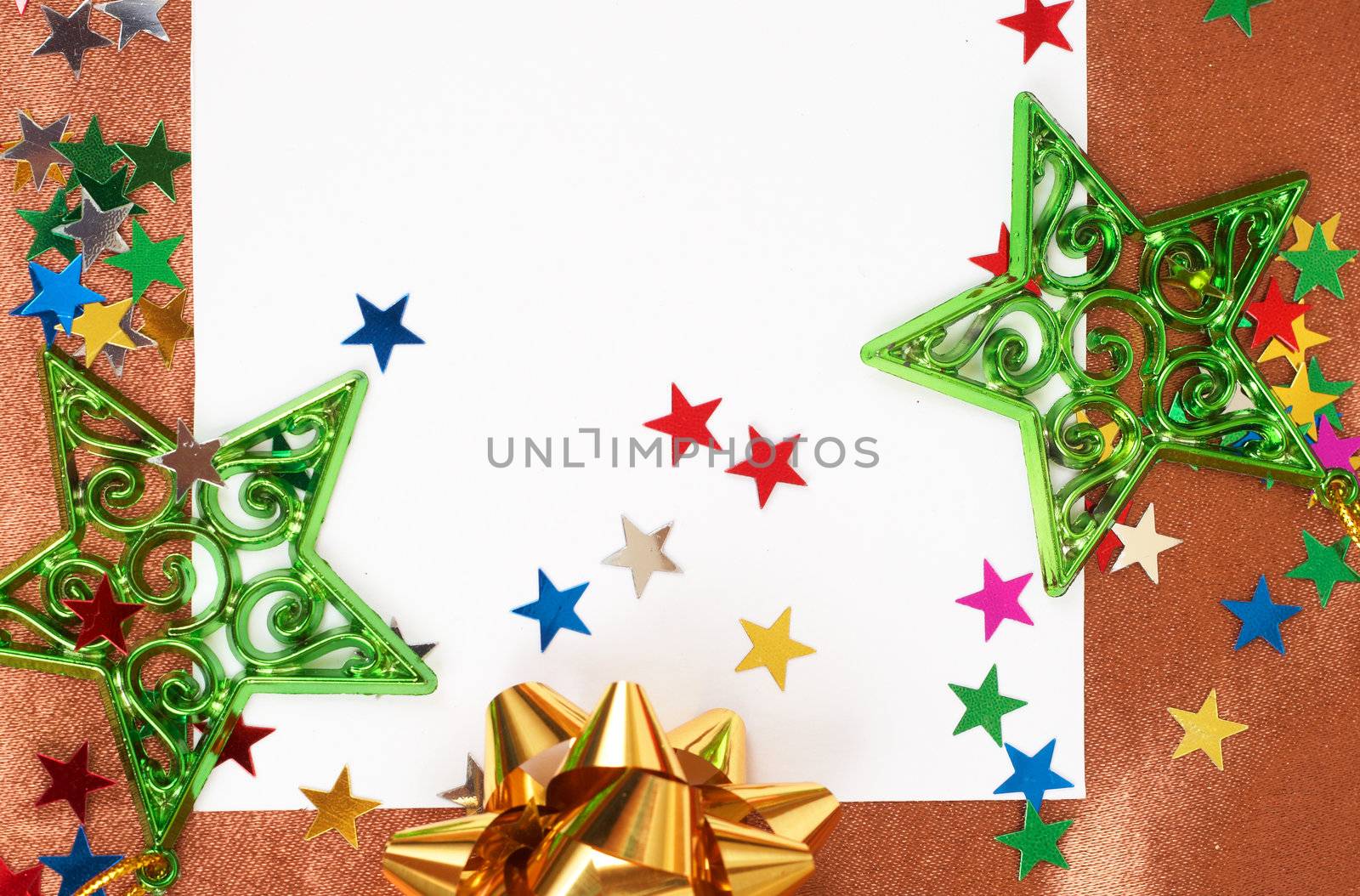 White Christmas card with stars and bows decorations on golden silk nackground