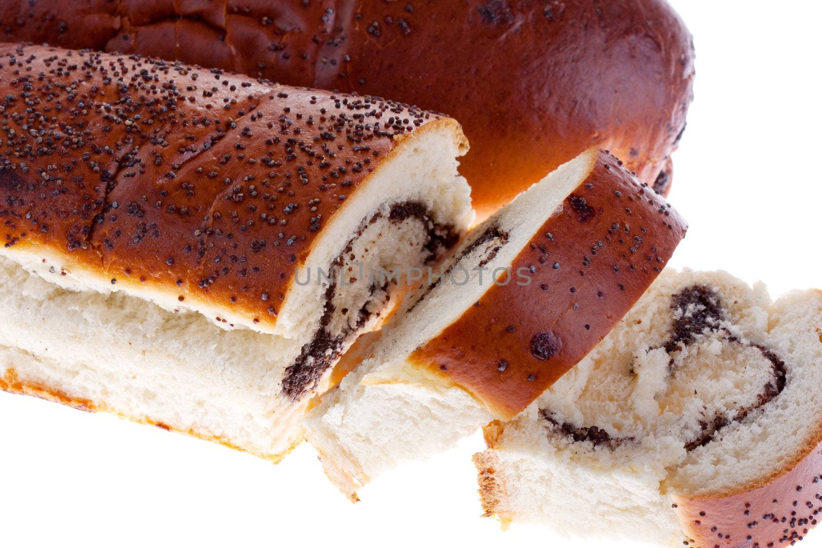 Sliced ​​bread with poppy seeds on a white background