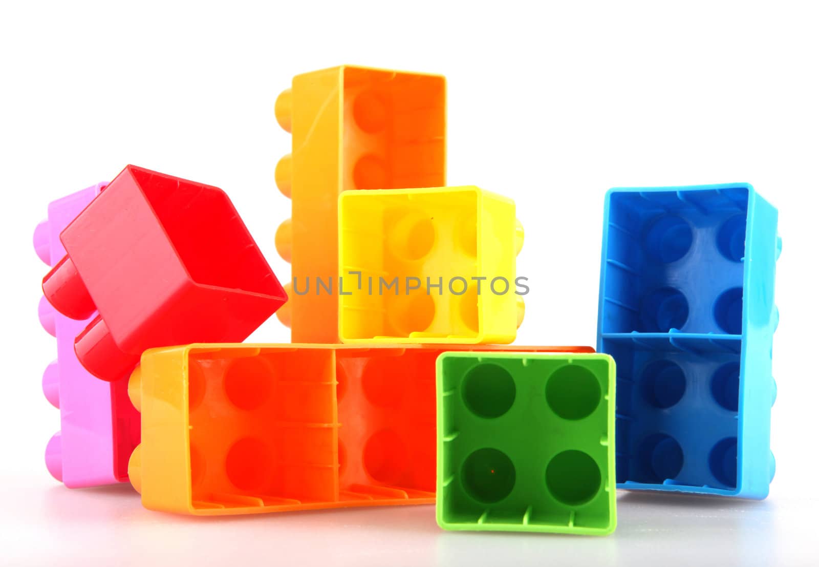 Plastic toy blocks on white background
