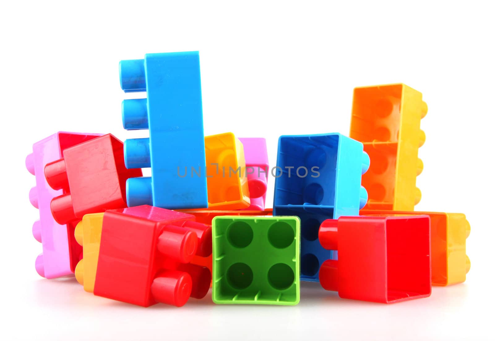 Plastic toy blocks on white background