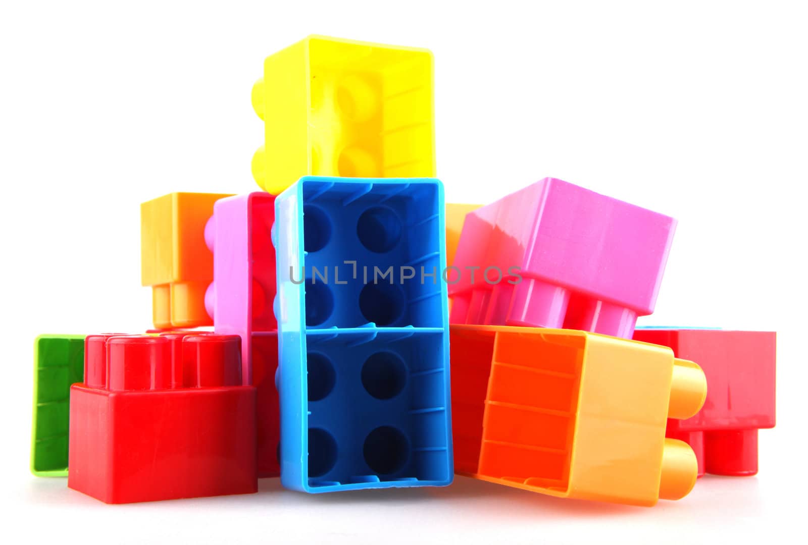 Plastic toy blocks on white background