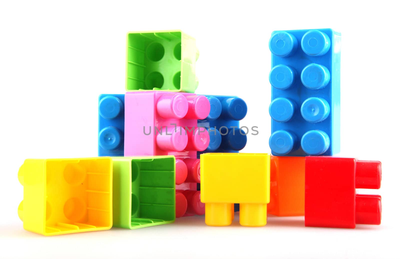 Plastic toy blocks on white background