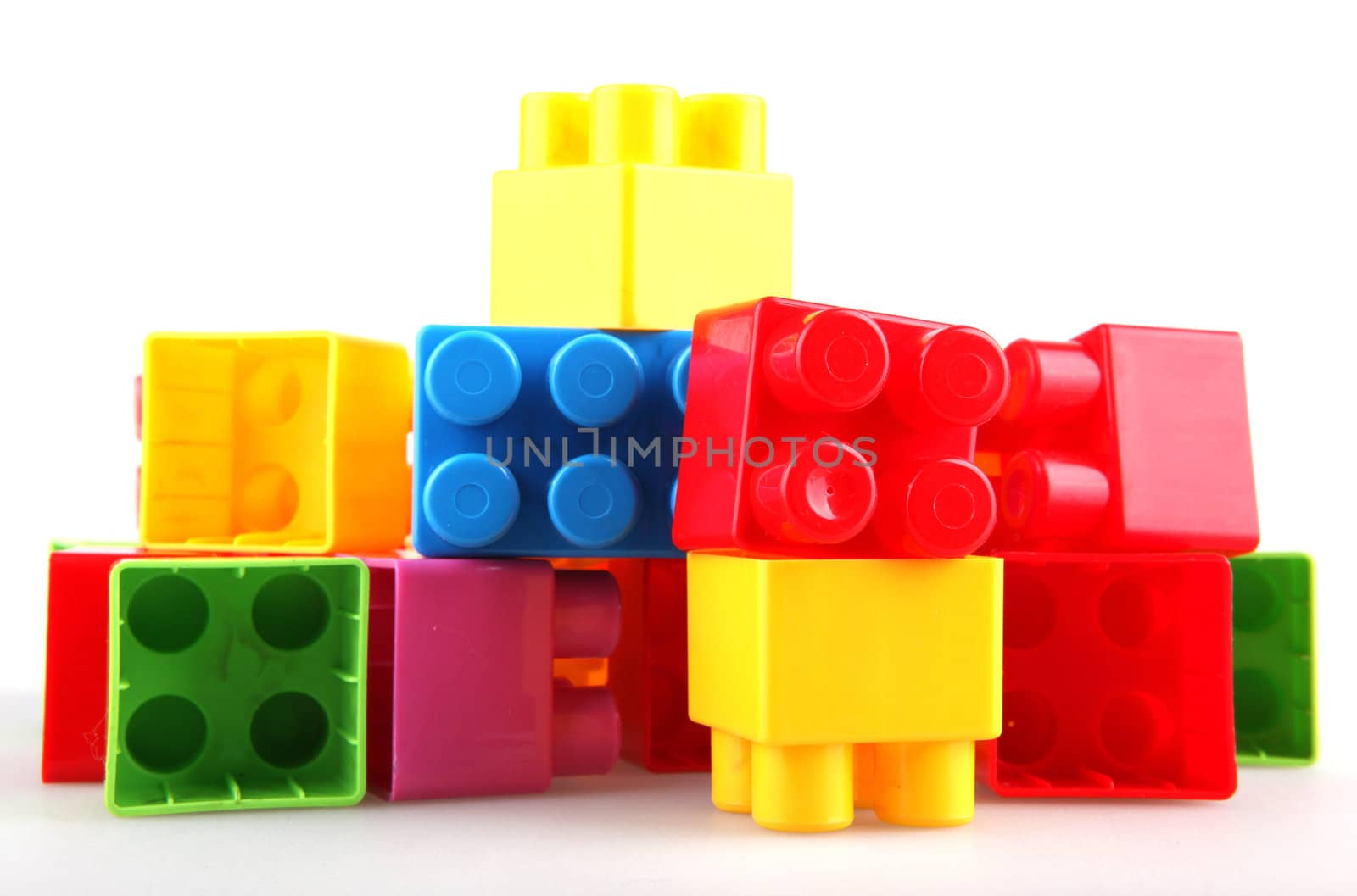 Plastic toy blocks on white background