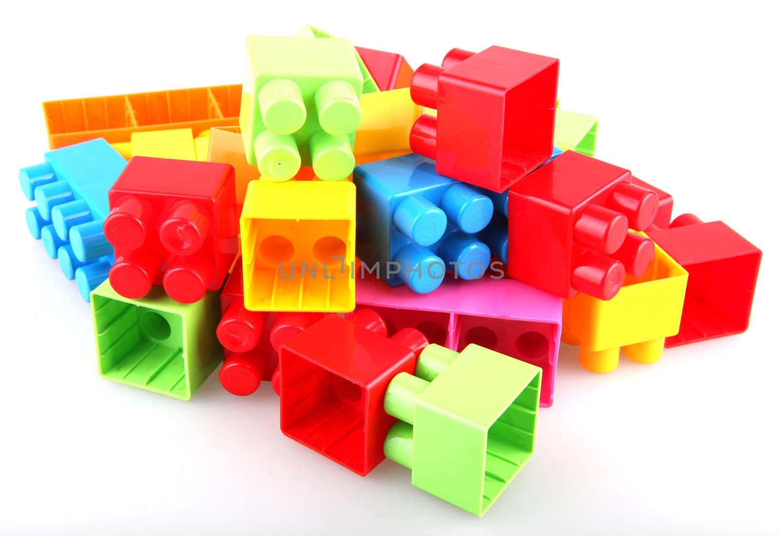 Plastic toy blocks on white background