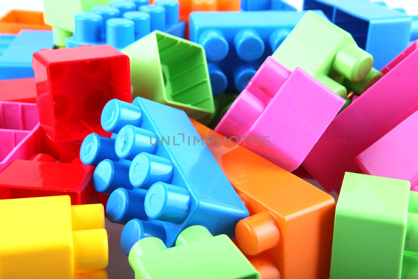 Plastic toy blocks on white background