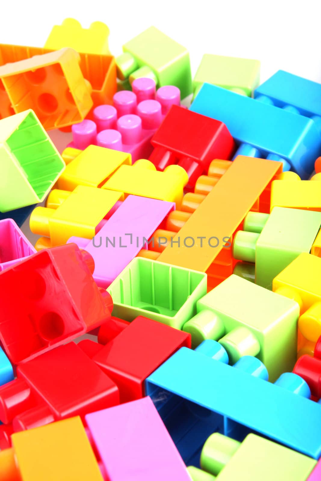 Plastic toy blocks on white background