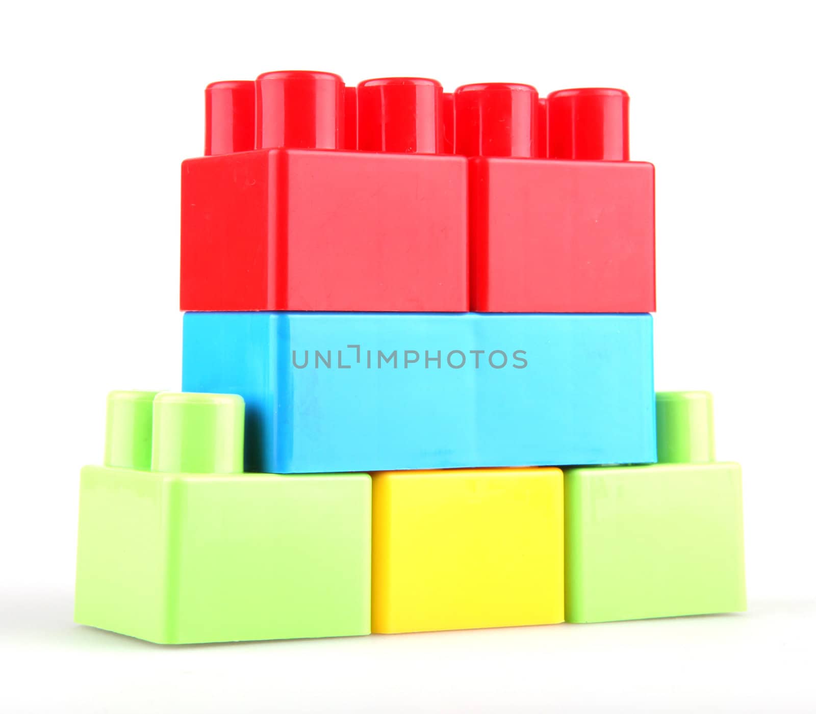 Plastic toy blocks on white background