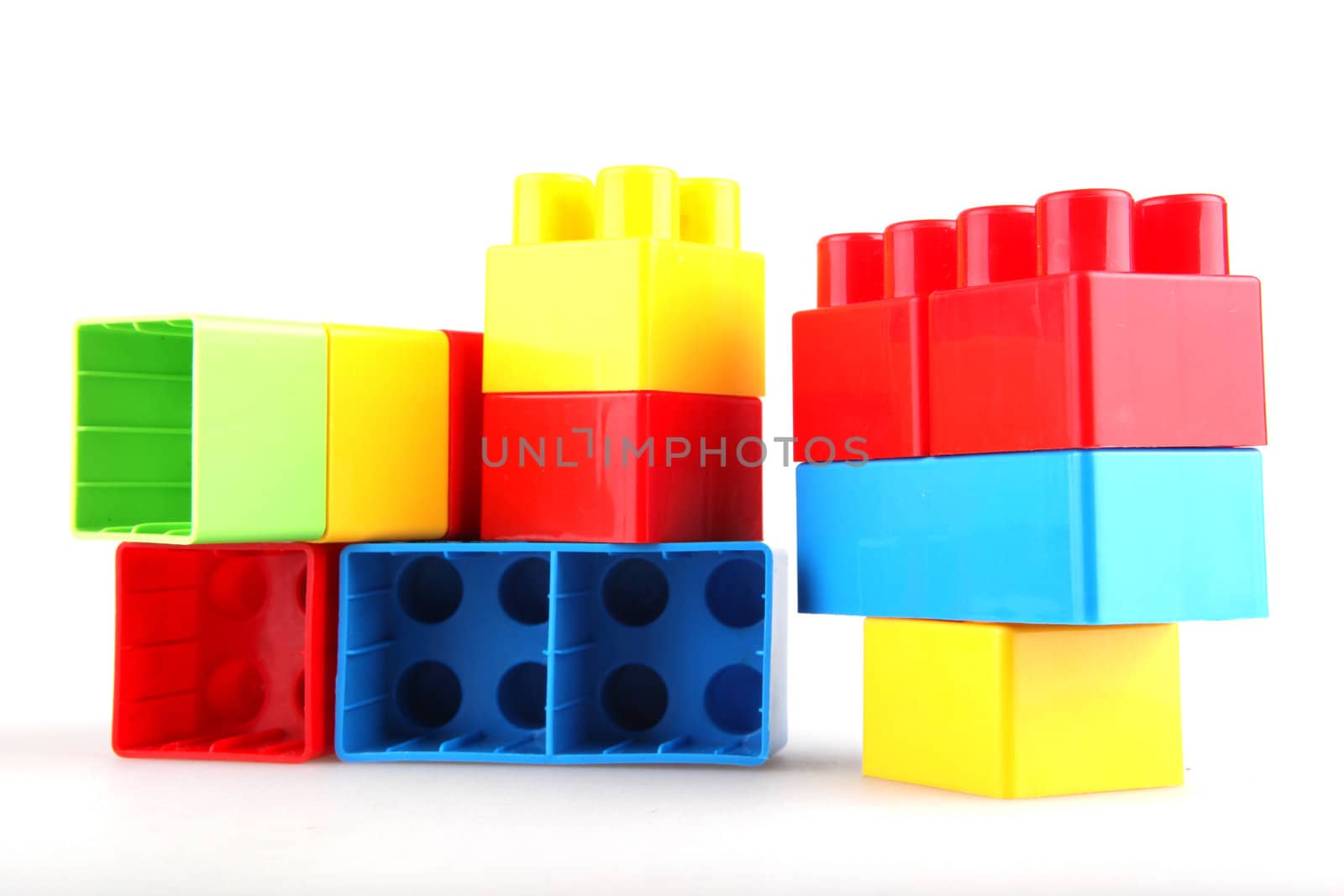 Plastic toy blocks on white background