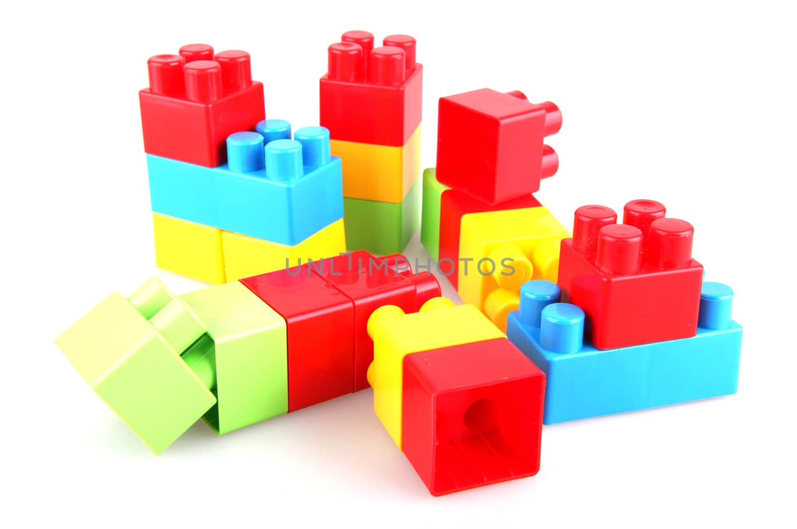 Plastic toy blocks on white background