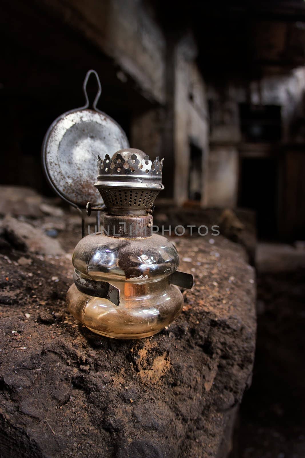 Old kerosene lamp in an abandoned, gloomy, creepy building of an old factory