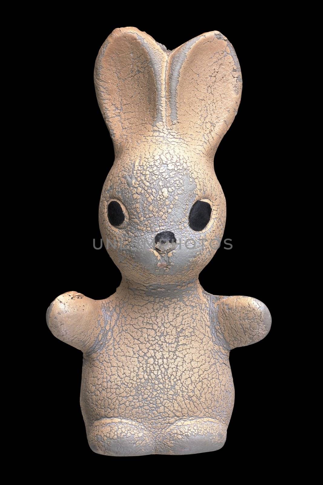 Old toy rabbit on a black background. Clipping path is included