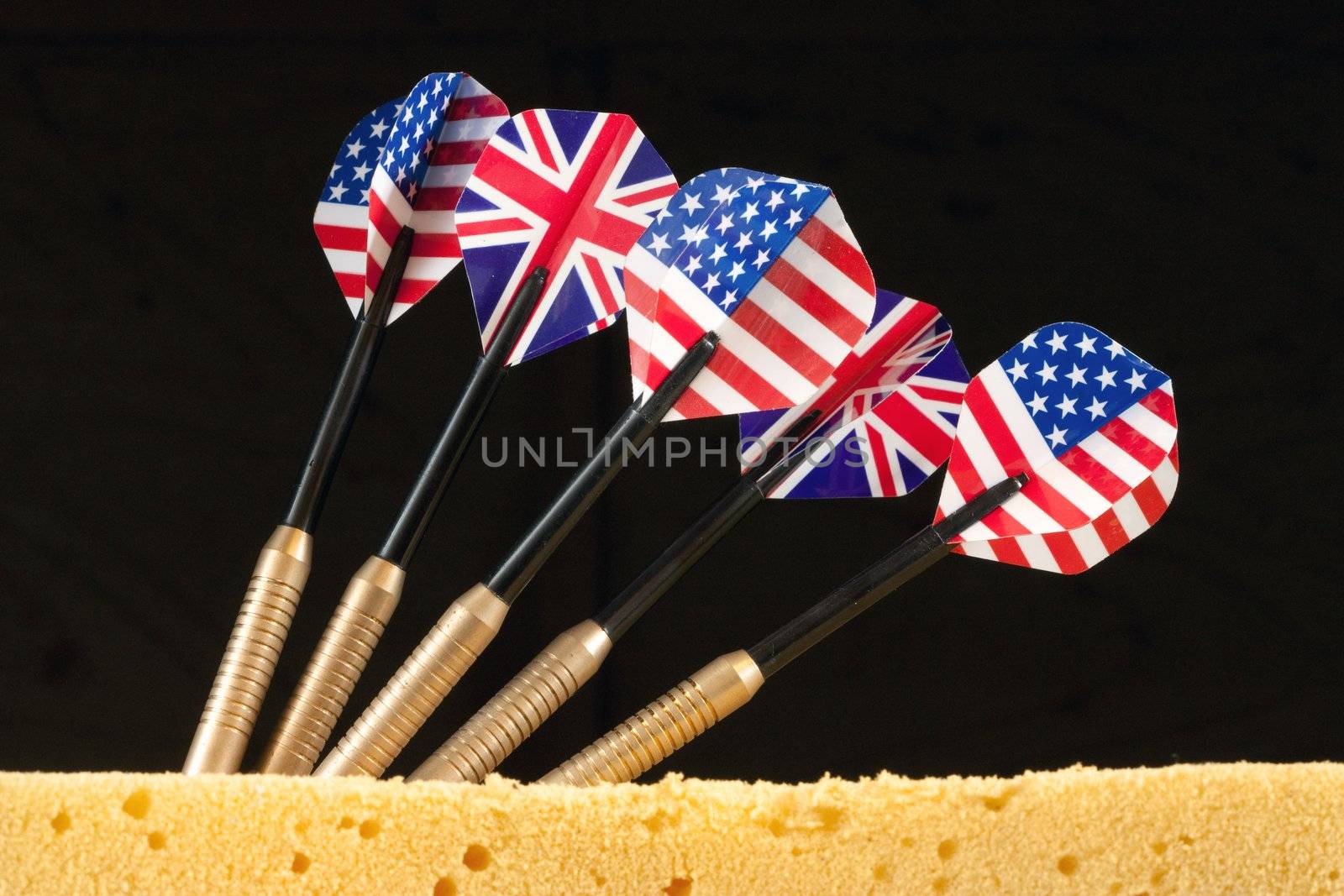 A bunch of darts with flags of the USA and the United Kingdom