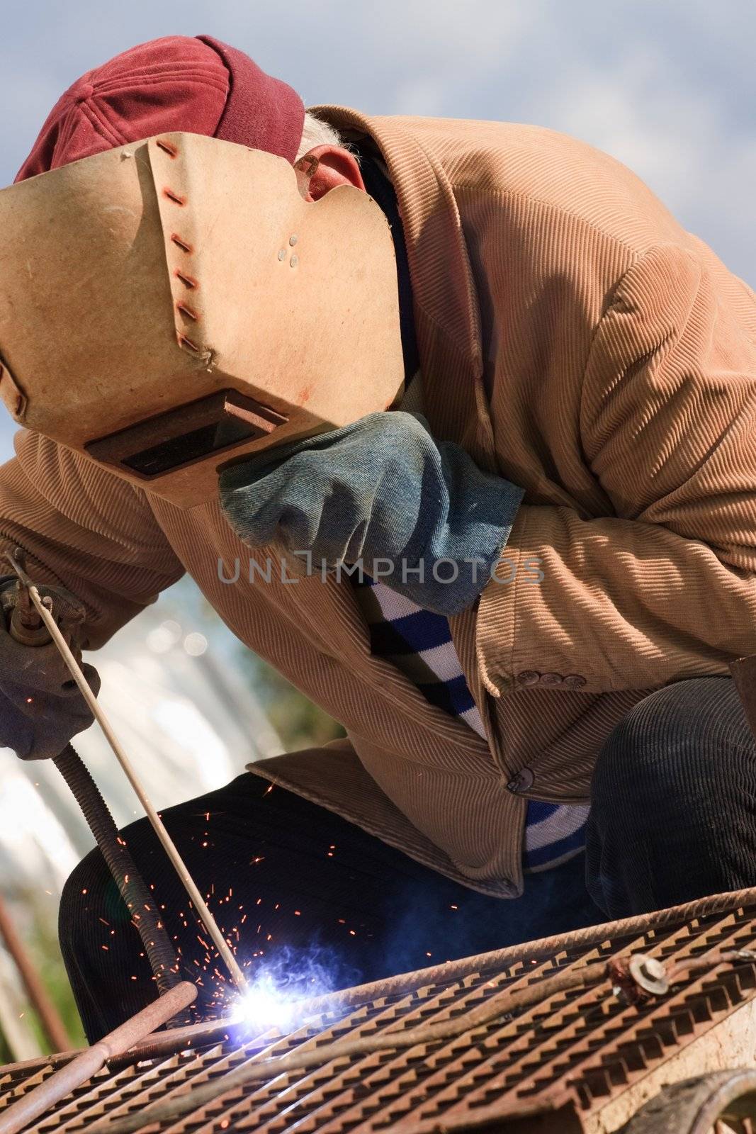 Old welder is working by andrius