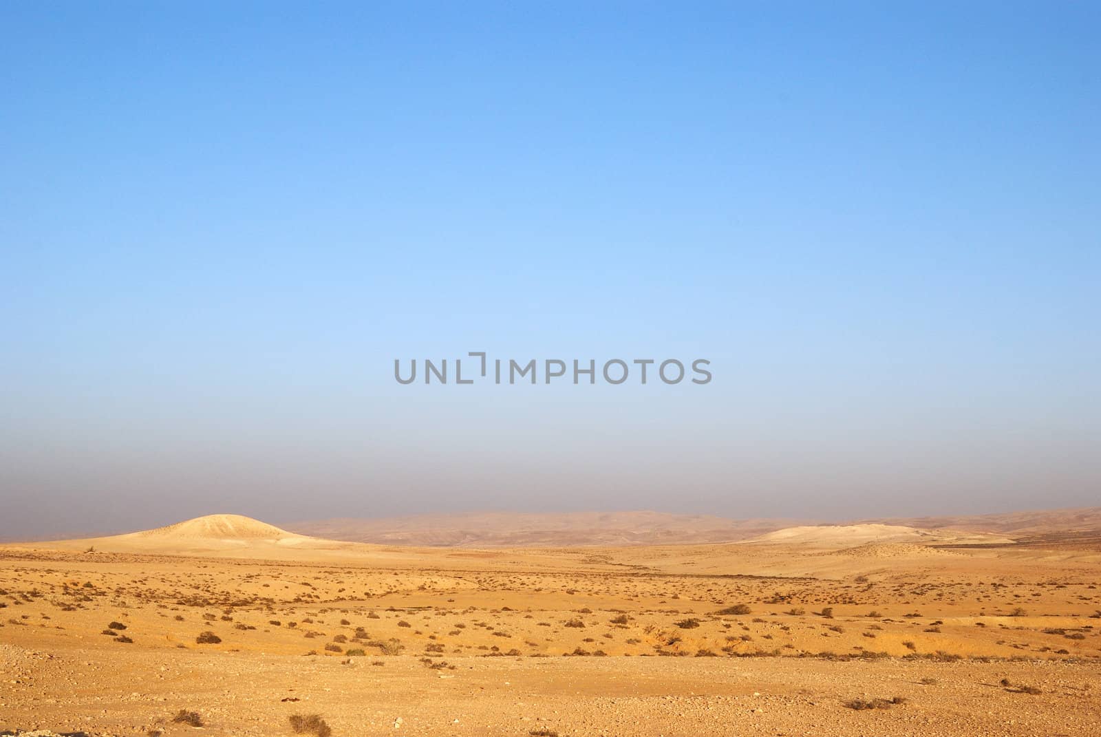 Fragment of Negev desert with mountains on a distance shot