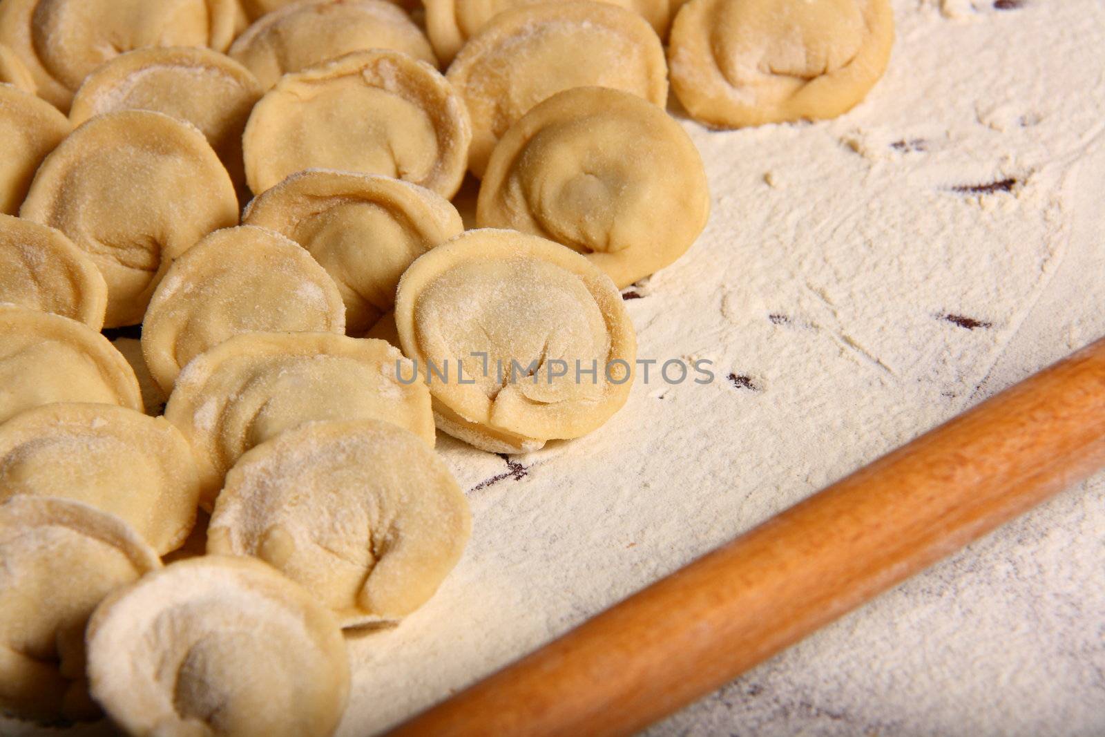 hand made ravioli getting prepared on table 