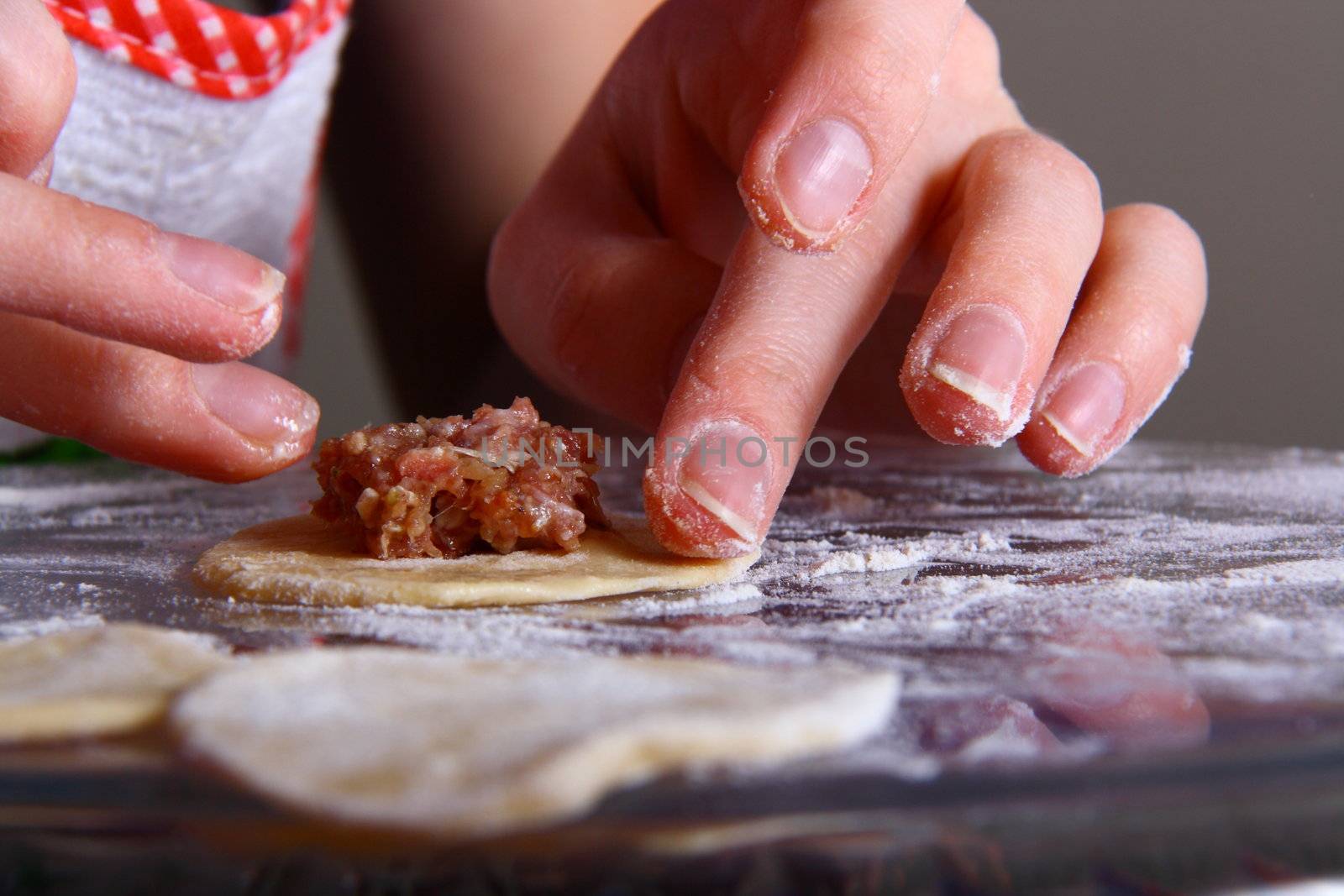 hand made ravioli getting prepared on table 