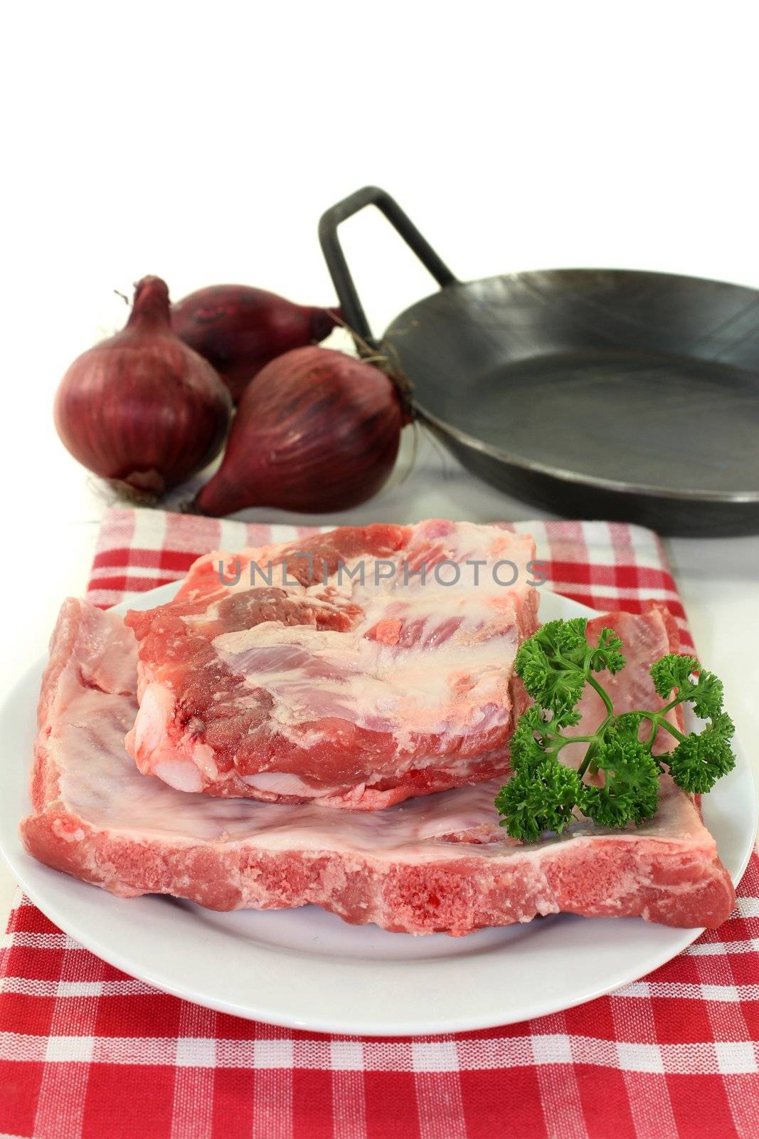 two pieces of spare ribs on a white background