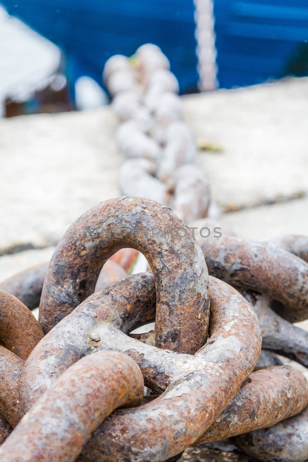 Closeup of ship anchor chain moored in the dock