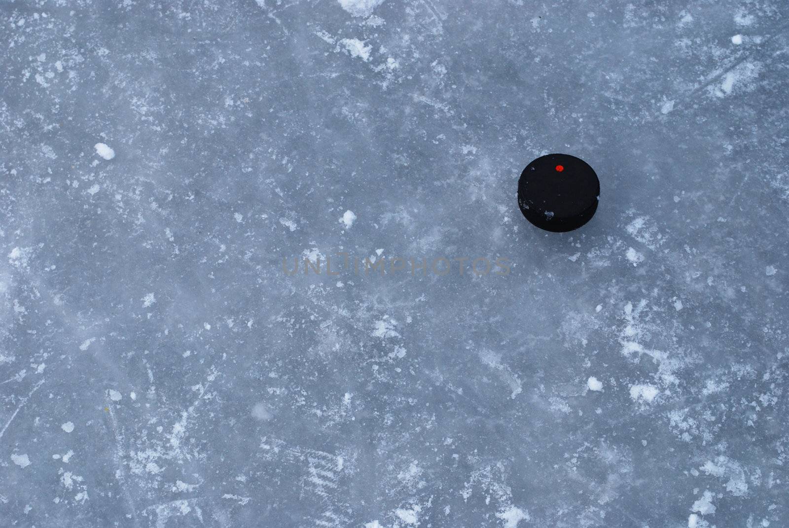 ice rink surface with a puck