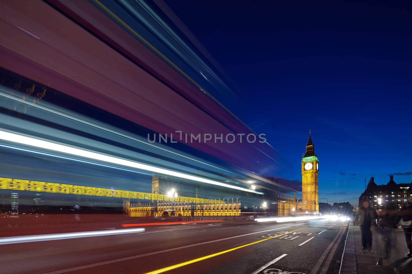 Big Ben in the evening. Dabldekker passes and leaves a line of light at slow shutter speeds. Photograph taken with the tilt-shift lens, vertical lines of architecture preserved