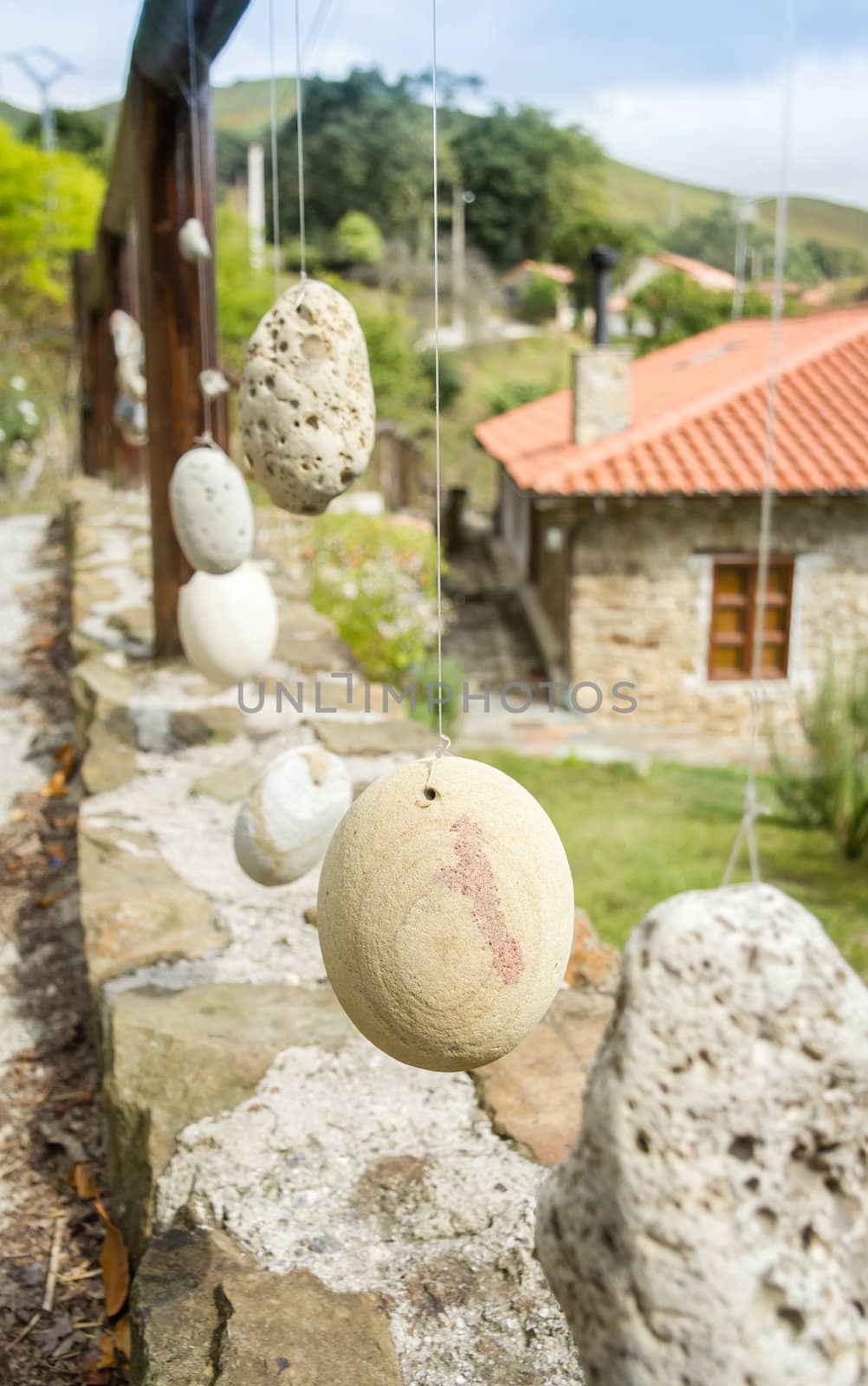 Wooden railing with hanged stones by doble.d