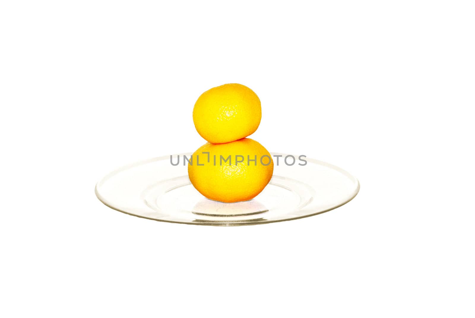 two tangerines on plate isolated on white              by svtrotof