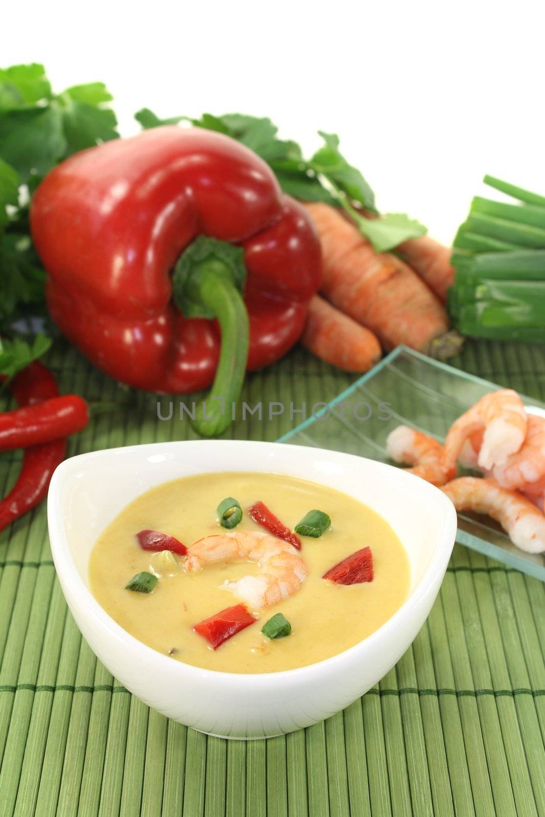 fresh Curry Soup with shrimp, bell pepper, leeks and coconut milk