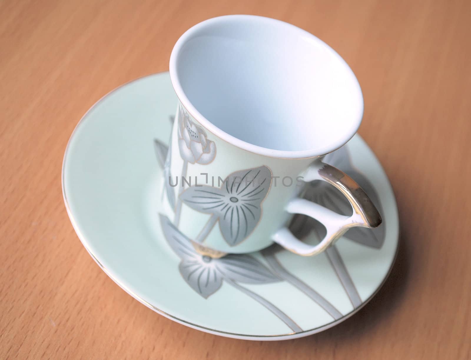 empty cup and saucer  with pattern  