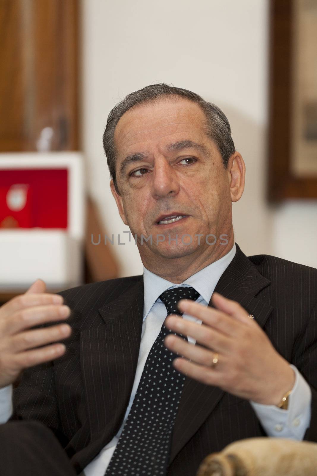 OPM, AUBERGE DE CASTILLE, VALLETTA, MALTA - MAY 12 - The Prime Minister of Malta, Dr. Lawrence Gonzi, with reporters from The Report Company in partnership with of Guardian News and Media UK on 12 May 2011.