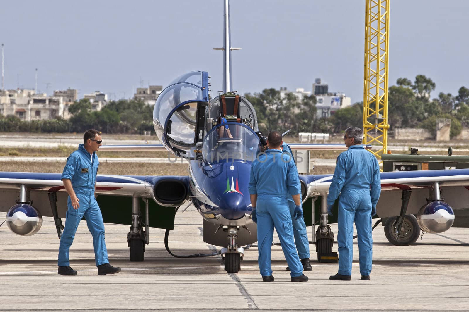 LUQA, MALTA - 25 SEP - Crew members from the Italian Frecce Tricolori aerobatic team check their aircraft before an aerial display during the Malta International Airshow on 25 September 2011