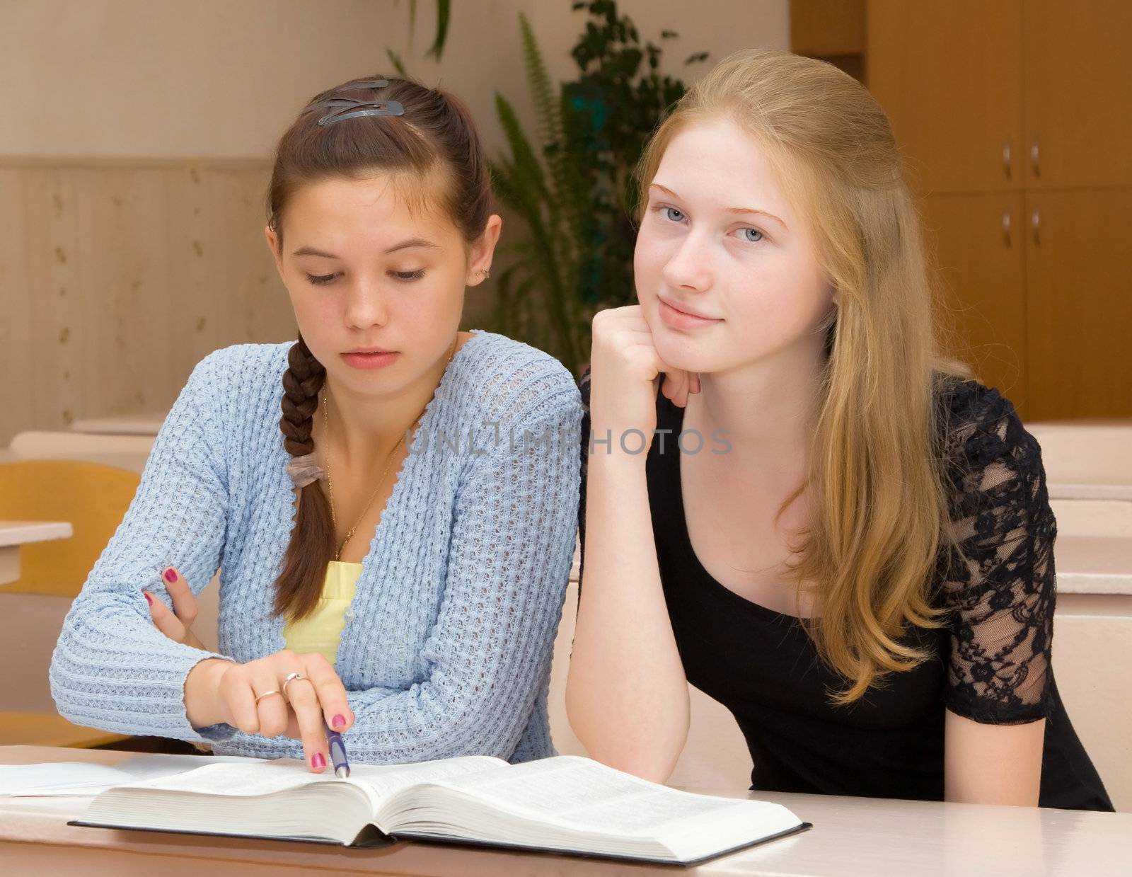 Female students are engaged in the classroom in his spare time