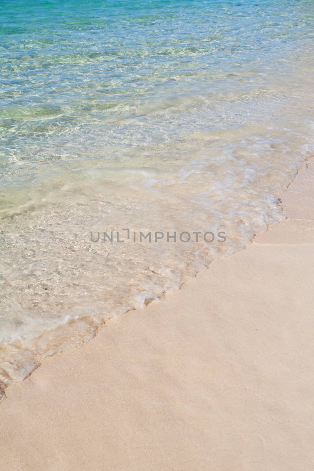 Stretch of Caribbean blue sea and white sand with copyspace. Cuba.