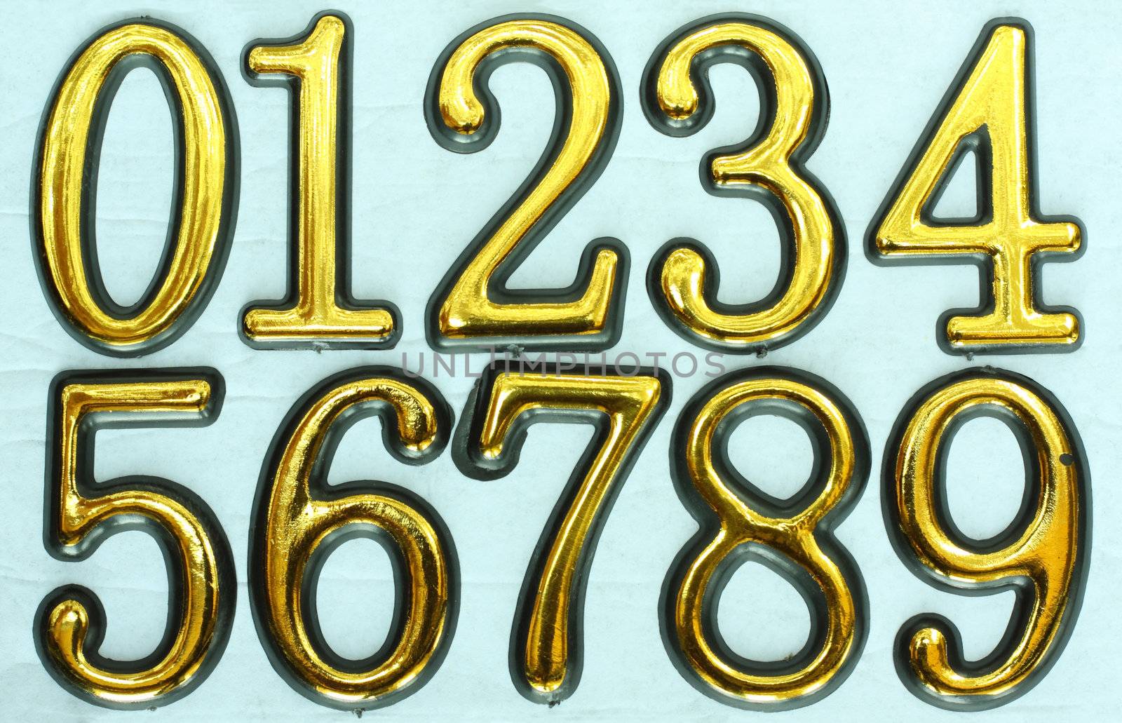 Golden bright numbers on a light blue background. Numbers 0, 1, 2, 3, 4, 5, 6, 7, 8 and 9.