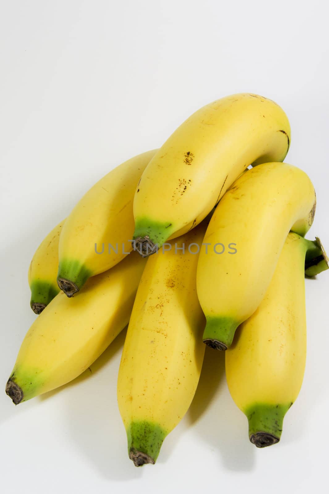 Ripe banana isolated on white background by Noppharat_th