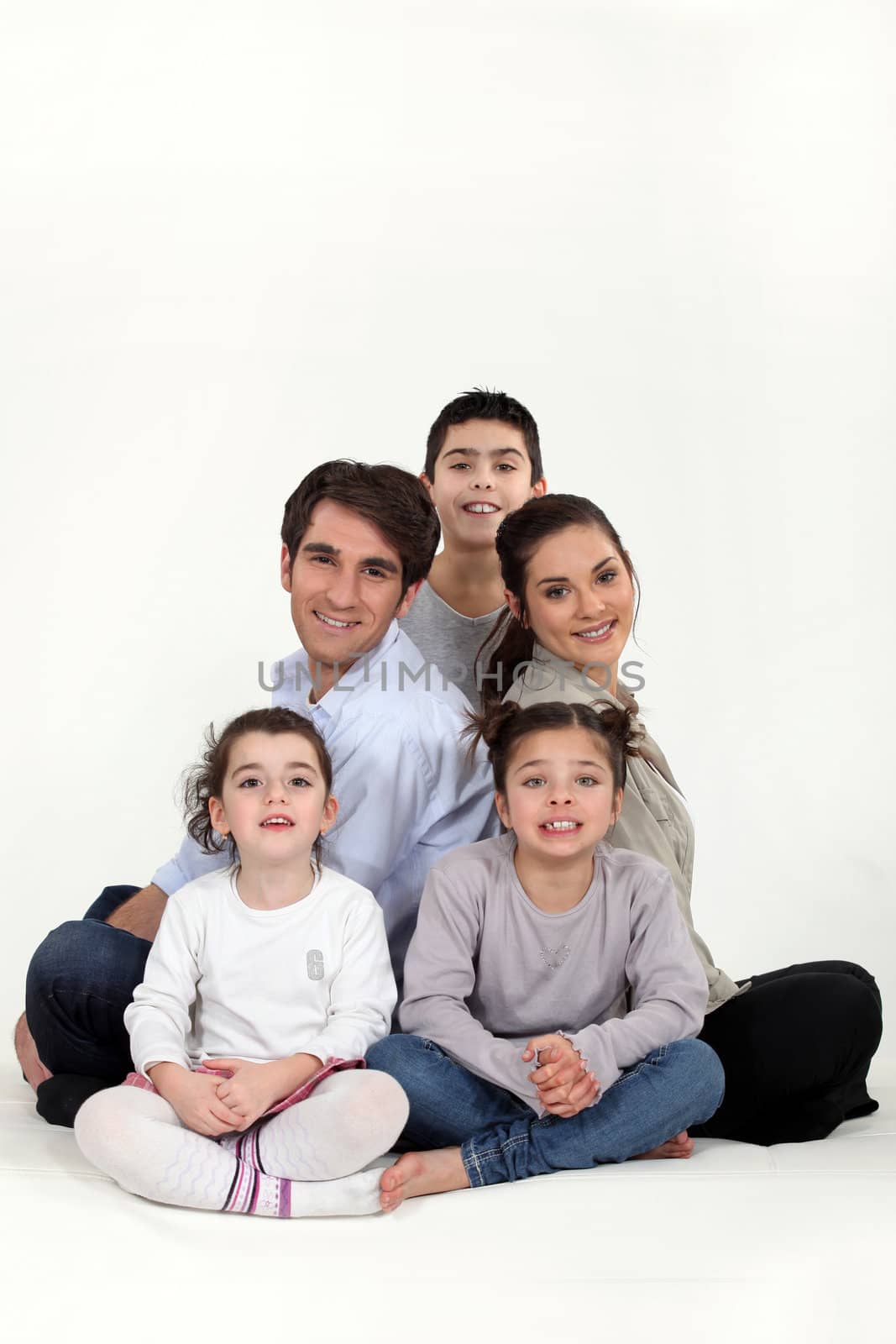 Parents with three children in studio by phovoir