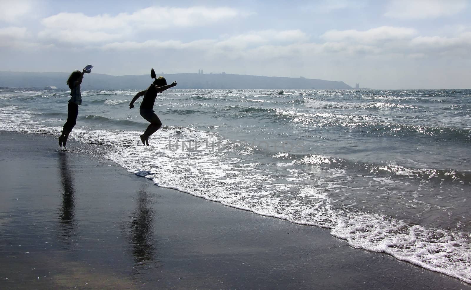 children jumping on the beach







children and the sea