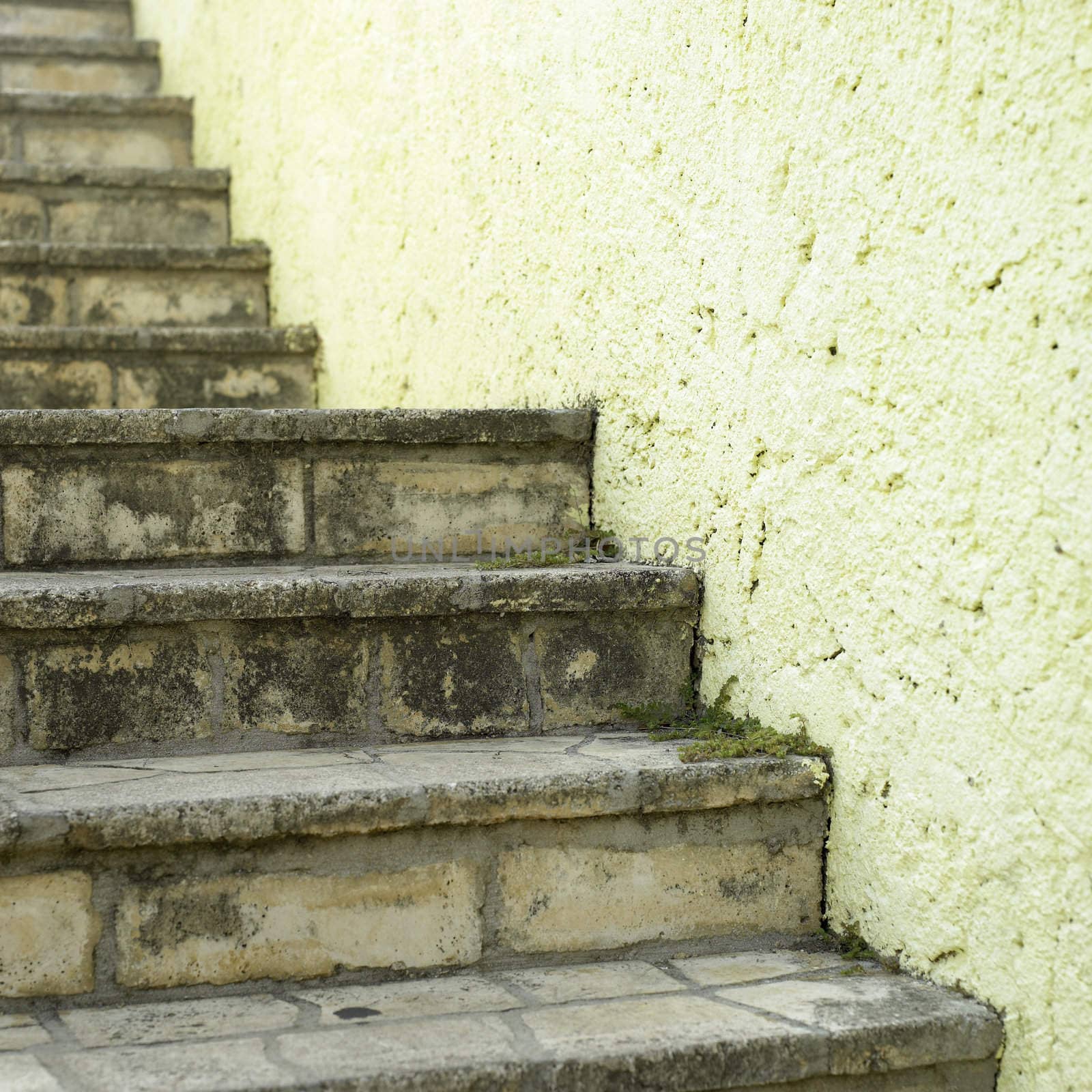 Stone stairs and yellow wall