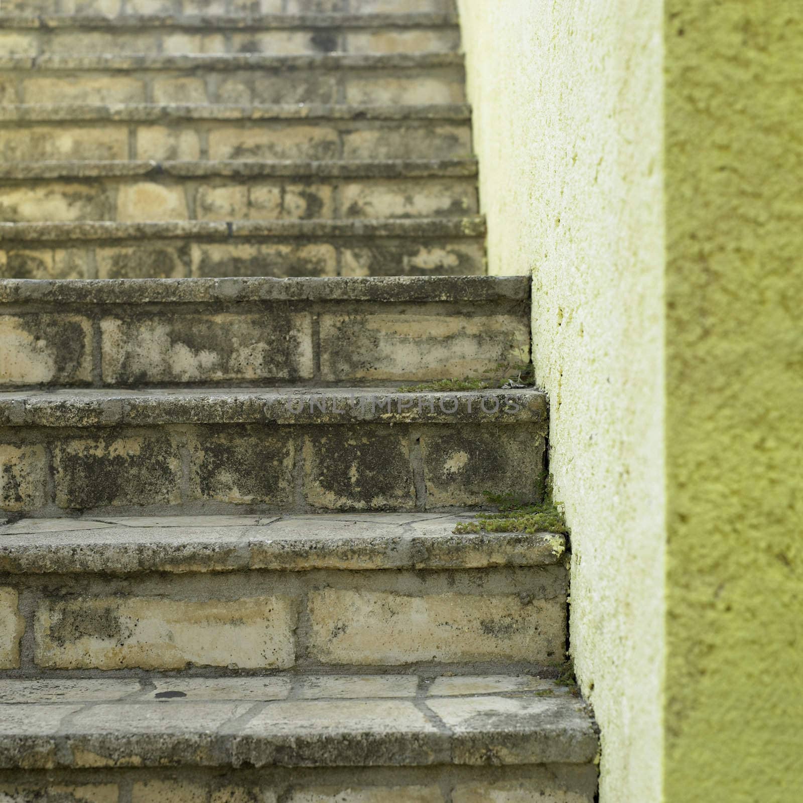 Stone stairs and yellow wall