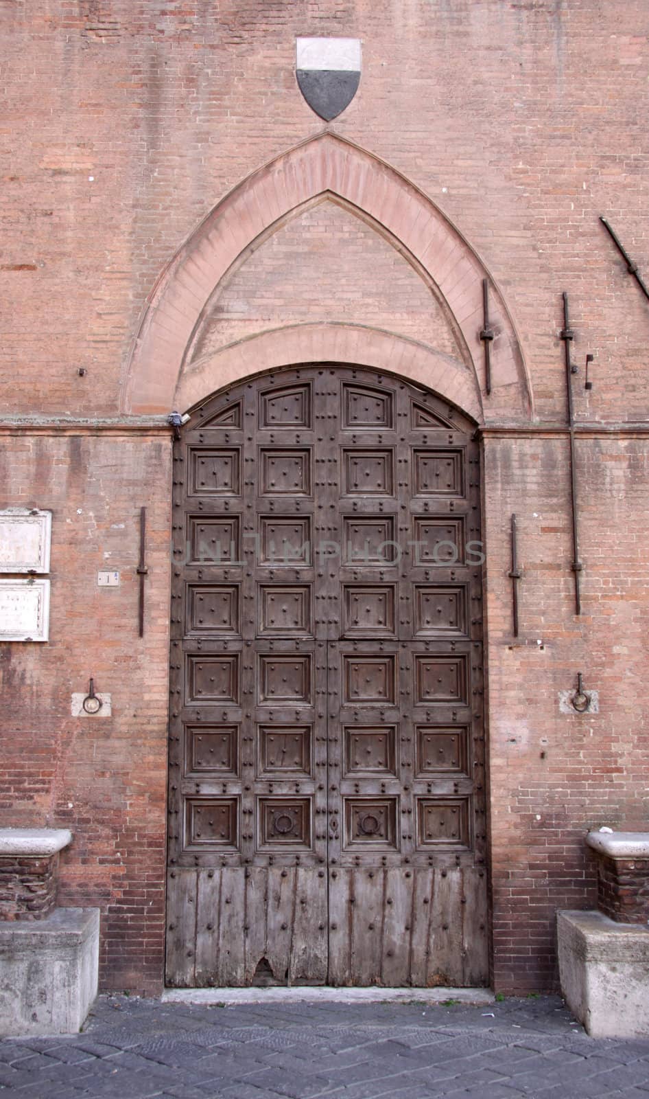 An old medieval door in the Italian town of Siena.