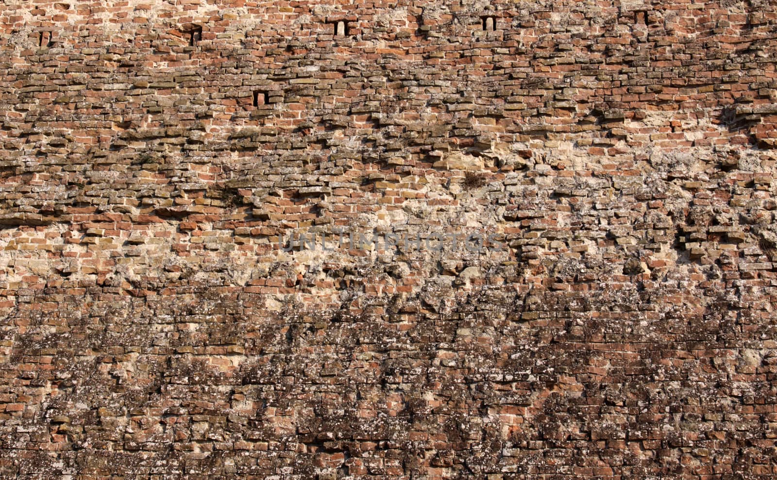 A close-up of a the city walls of the medieval town of Siena, in Tuscany, Italy.
