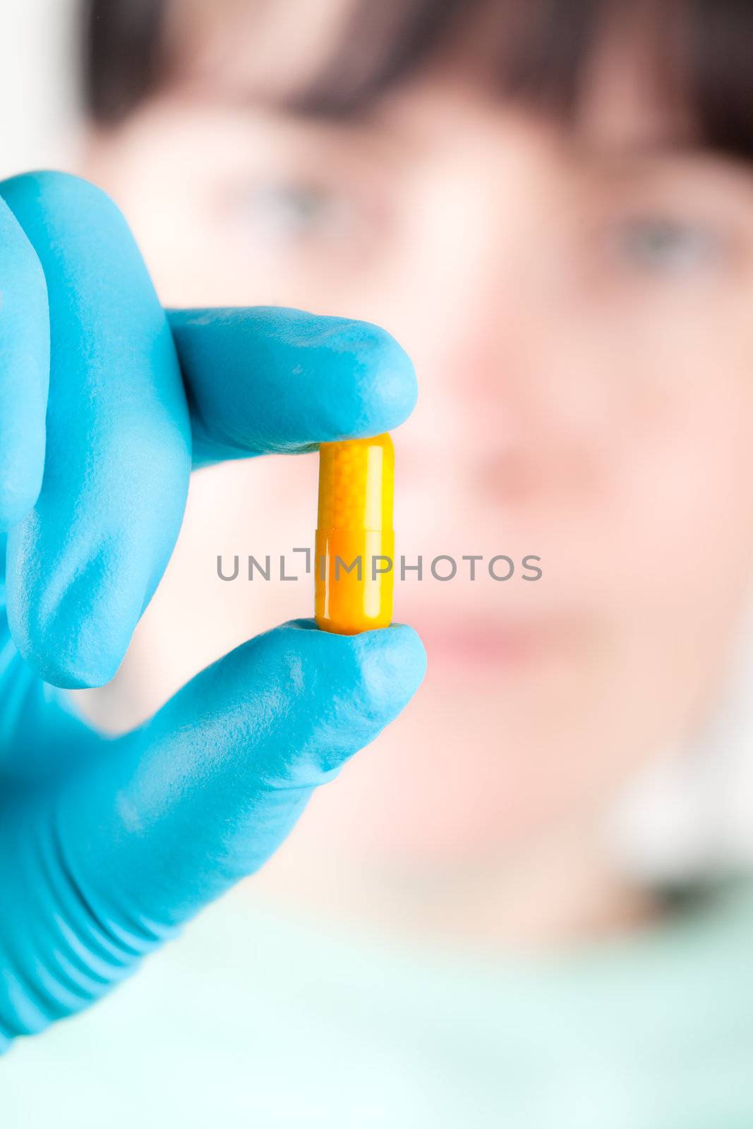 Medical woman with pill, capsule