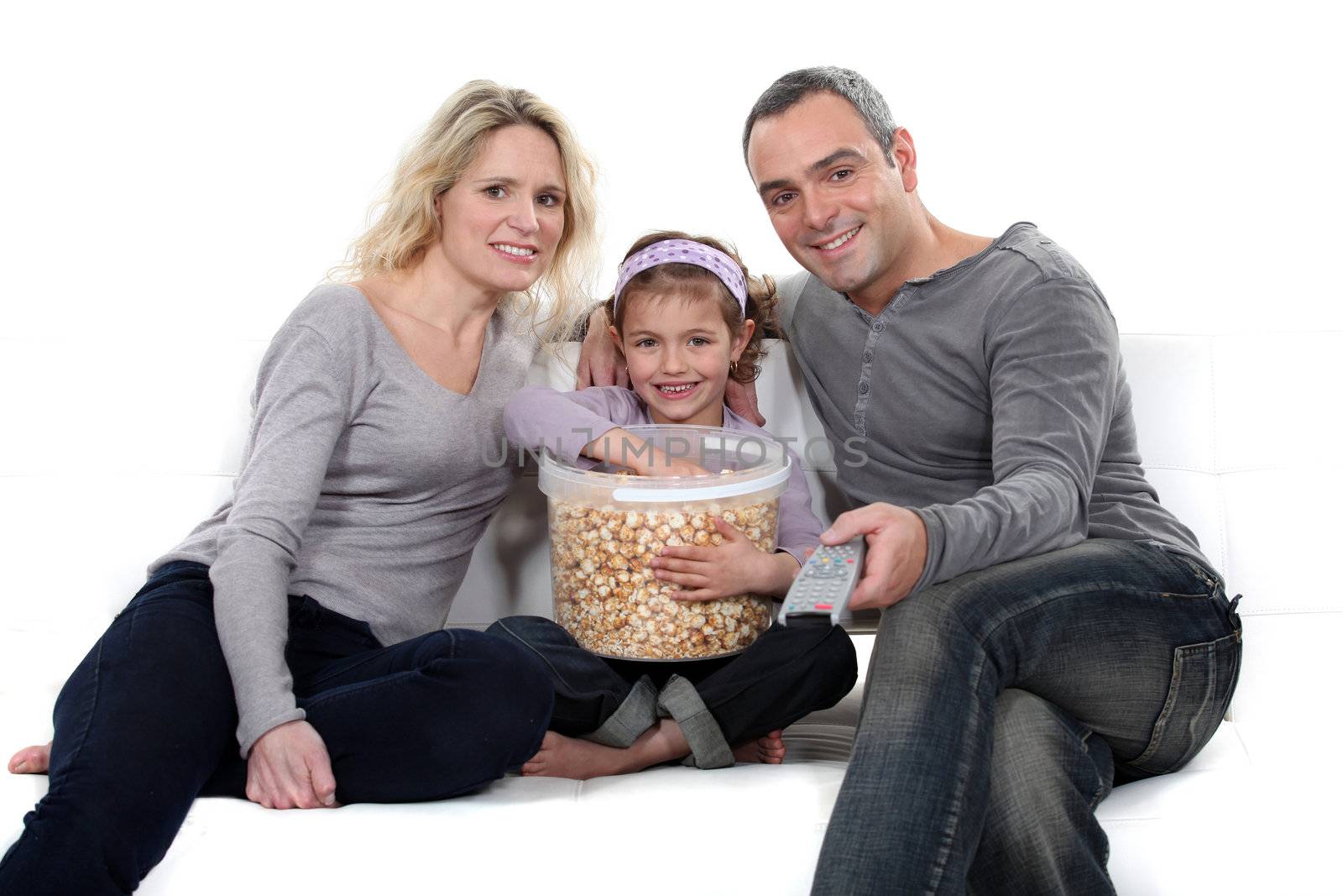 Family with popcorn by phovoir