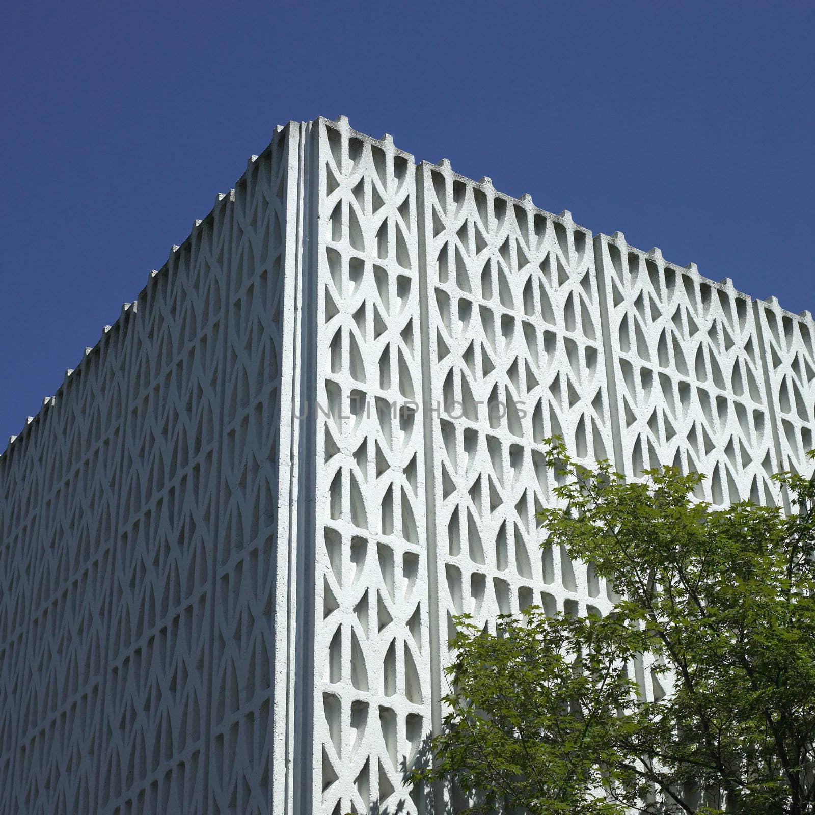 Patterned wall and blue sky