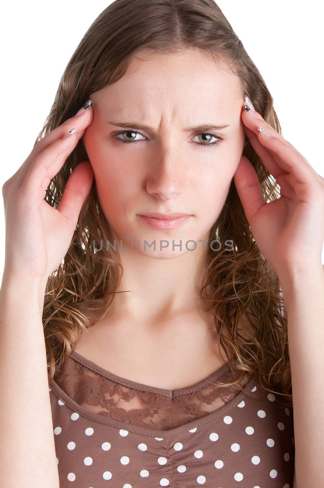 Woman suffering from an headache, holding her hands to the head, isolated in a white background