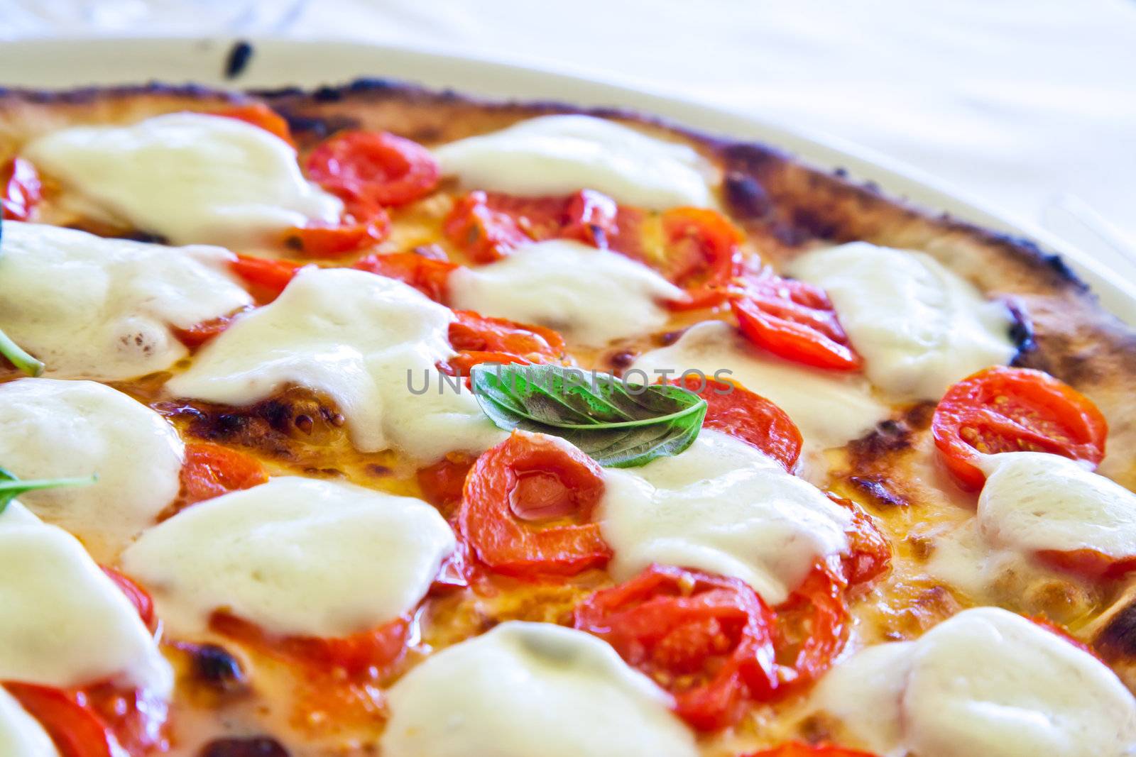 This is a true Italian Pizza. Traditional Pizza Margherita served in a Capri's restaurant, Naples Gulf, Italy.