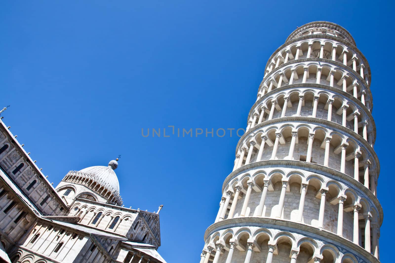 Italy - Pisa. The famous leaning tower on a perfect blue bakcground